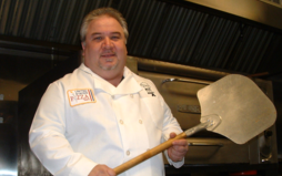 Pizza Mike on stage at the Columbus Italian Festival demonstrating how to prepare Braciole